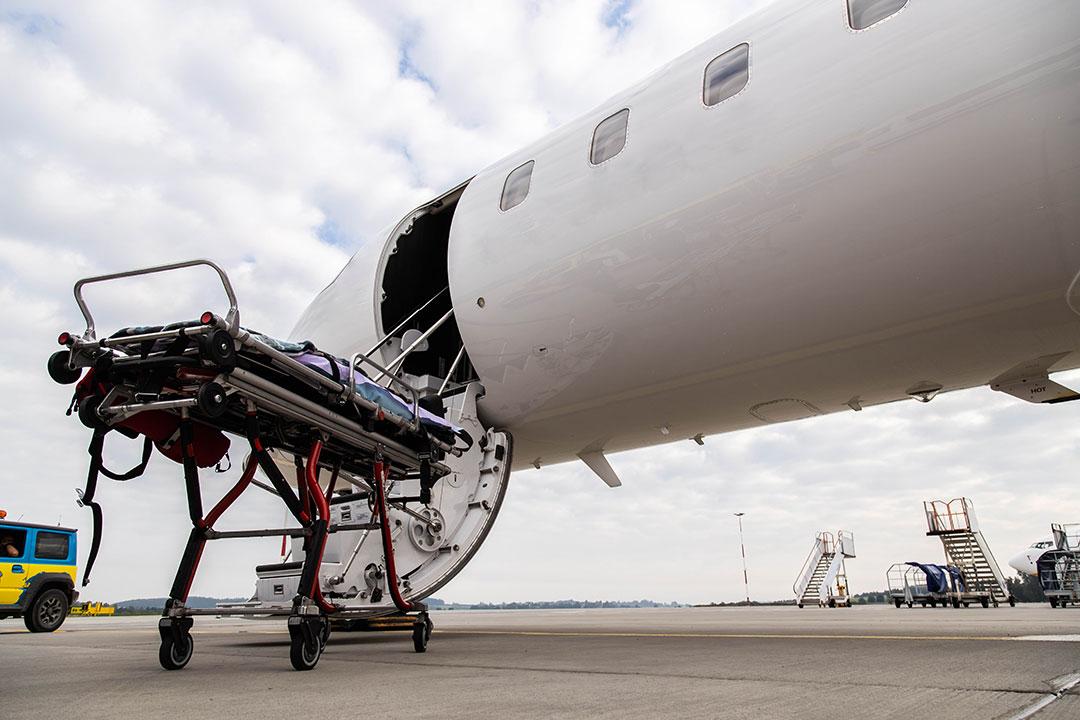 A stretcher being placed on an air ambulance