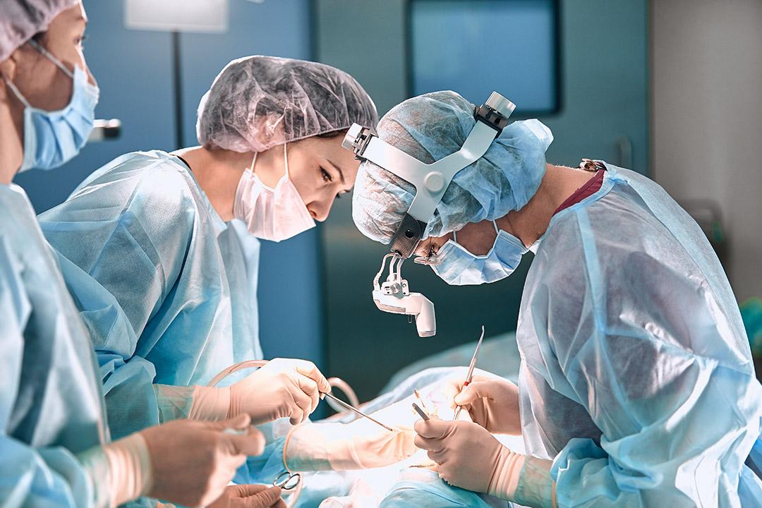 Surgeons operating on a patient