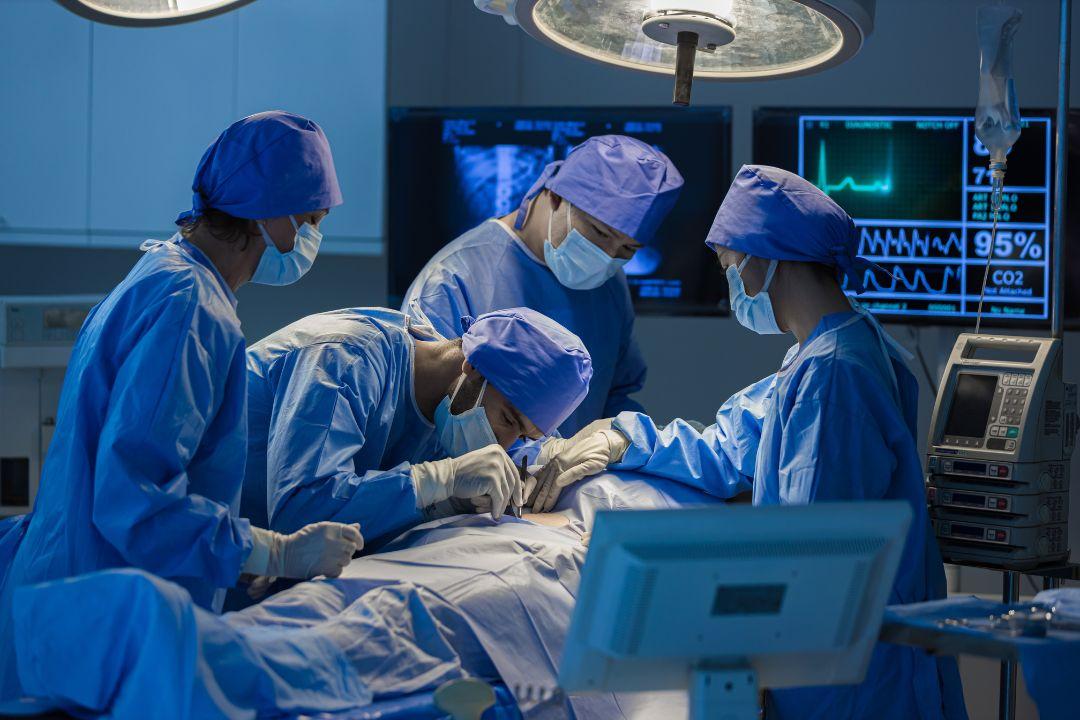 Surgeons operating on a patient