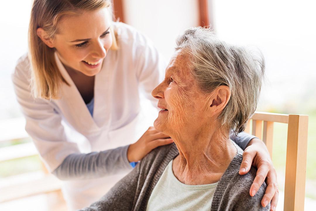 Healthcare professional with elderly patient