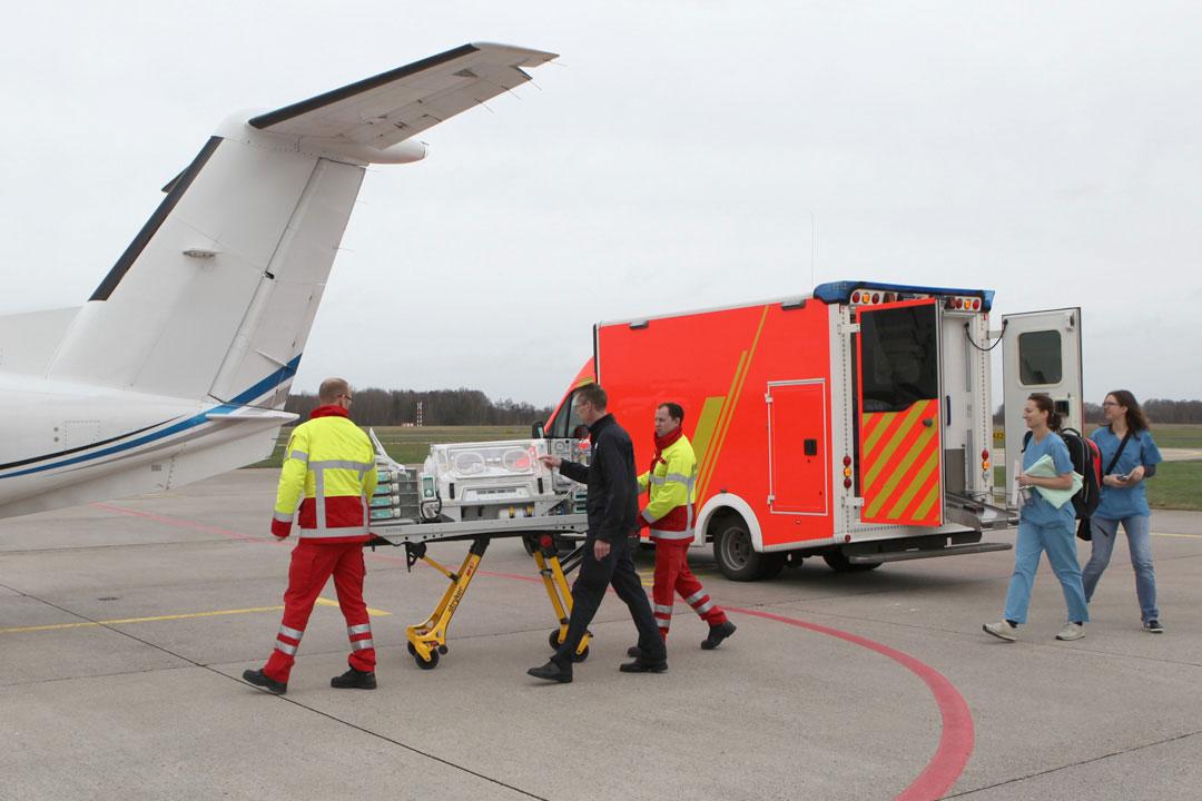 A patient being transported in an incubator