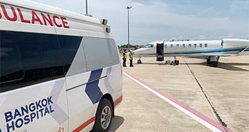 air ambulance plane and ground ambulance in airport