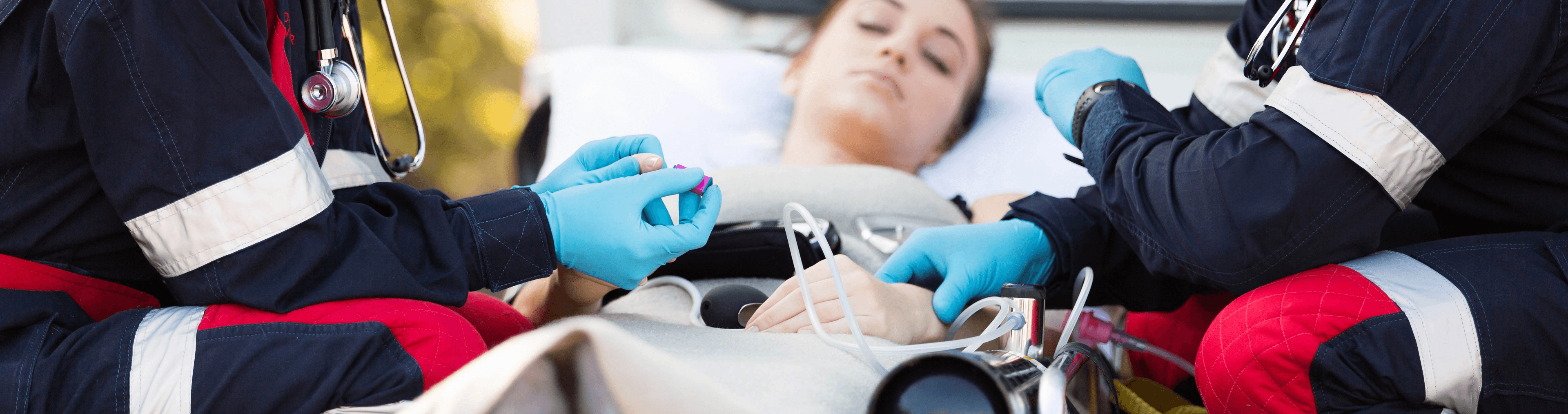 Paramedics checking the vitals of a patient