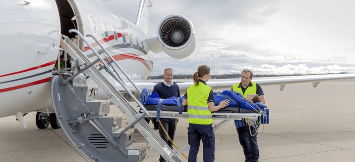 Patient on a stretcher being placed on an air ambulance